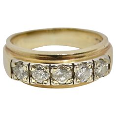 Elevate your jewelry collection with this 1970s 18K Gold Custom Diamond Ring. This classic and versatile ring features five dazzling diamonds, totaling approximately 1.5 carats, set within a beautiful 18K gold band. With its timeless design and unisex appeal, it's a piece of enduring elegance that can be worn and cherished for generations. This ring captures the essence of the 1970s, offering a piece of history and style. Crafted from 18K gold and adorned with brilliant diamonds, this ring exude Antique Rings Gold 1stdibs, Prada Jacket, Custom Diamond Rings, Unisex Ring, Ring Fit, The 1970s, Brilliant Diamond, Gold Band, Gold Bands