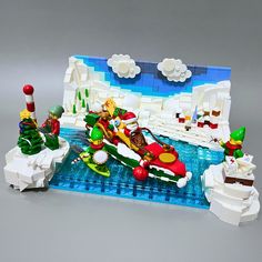 a lego christmas scene with santa and his sleigh