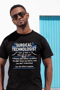 a man wearing a black t - shirt with the words surgical techlogist on it