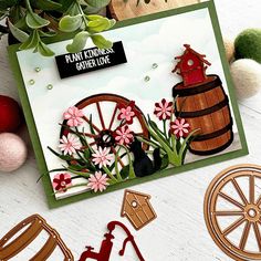 a card with flowers and a wheel on it