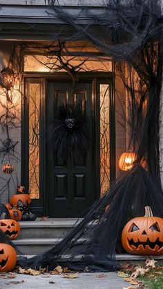 halloween decorations on the front steps of a house