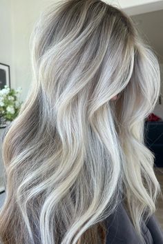 Woman with platinum balayage. Icy Blonde With Root Melt, Ashy Lived In Blonde, Ashy Blonde With Lowlights, Beige Ash Blonde Hair, Bright Ashy Blonde Hair, Icy Blonde With Lowlights, Vanilla Blonde Hair Balayage, Ice Blonde Hair With Lowlights, Cool Tone Blonde Highlights