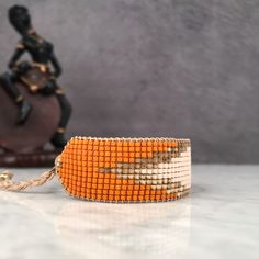 Unique Adjustable Bracelet With Tiny Beads, Bohemian Orange Beaded Bracelets As Gift, Bohemian Orange Beaded Bracelets For Gifts, Orange Bohemian Beaded Bracelets For Gifts, Unique Orange Adjustable Bracelet, Unique Hand-strung Adjustable Friendship Bracelets, Unique Adjustable Orange Bracelet, Unique Adjustable Orange Bracelets, Adjustable Orange Faceted Beaded Bracelet