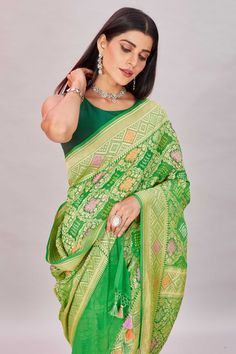 Elegant green georgette Banarasi saree is a perfect choice for festive occasions! It is enhanced with zari minakari jaal and comes with a matching blouse piece. Disclaimer: The shown stitched blouse on the model is for display purpose only. The saree comes with a matching blouse piece and finished with fall and piko. Green Pre-draped Saree With Meenakari For Puja, Festive Pista Green Banarasi Silk Pre-draped Saree, Transitional Green Pre-draped Saree With Self Design, Green Semi-stitched Pre-draped Saree With Meenakari, Festive Green Paithani Silk Pre-draped Saree, Green Chanderi Pre-draped Saree For Puja, Green Dola Silk Pre-draped Saree With Dupatta, Festive Green Georgette Pre-draped Saree, Green Georgette Pre-draped Saree For Transitional Season