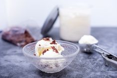 a bowl filled with ice cream sitting on top of a table