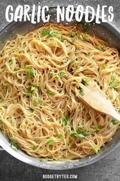 a pan filled with garlic noodles on top of a table