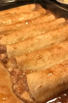 some food is cooking in a pan on top of the stove and ready to be eaten