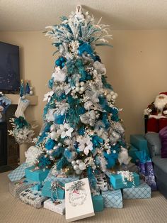 a christmas tree with blue and silver decorations