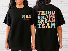 two women wearing t - shirts that say, third grade dream team