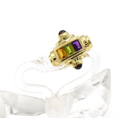 14kt yellow gold three stone gemstone ring. Made with genuine 14kt yellow gold and a genuine Amethyst, Green Peridot and Yellow Citrine gemstones with genuine Garnet cabochons on the sides. The stones are set in the center and are baguette shaped stones. Art Deco style ring. Statement ring. Ring is currently a size 6.75 but can be adjusted upon request. Center stones are genuine Amethyst, genuine Green peridot and genuine Yellow citrine. Stone are approx. 4x7mm each. All three stone are set side Stones Art, Gemstone Art, Heart Necklace Diamond, Three Stone Ring, Heart Pendant Diamond, Yellow Citrine, Citrine Stone, Long Pendant Necklace, Green Peridot