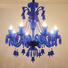 a blue chandelier hanging from the ceiling