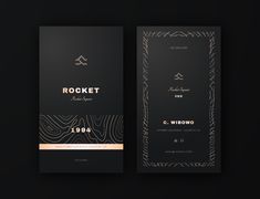 two black and gold business cards on a dark background, with the words rockett