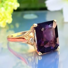 5.50 Carat Natural Amethyst & Diamonds 14k Solid Gold Ring Ring Material: 14k Solid Gold  Total Metal Weight: 3.8 Grams  Gemstone: Natural Amethyst Gemstone Color: Purple Gemstone Shape: Emerald Gemstone Dimensions: 12.00x10.00 mm Gemstone Carat Weight: 5.40 Carat Gemstone Quantity: 1 Natural Round Shaped Diamonds Diamonds Quantity: 2 Diamonds Total Carat Weight: 0.10 Carat Total Carat Weight: 5.50 Carat Ring Quantity: One  ring Condition: New Made in the USA Delivered in an elegant gift box 💜 Please do not hesitate to ask any questions and we will be happy to assist You  💜 Formal Purple Sapphire Ring With Gemstone Accents, Purple Ring With Gemstone Accents For Formal Occasions, Formal Amethyst Birthstone Ring With Gemstone Accents, Purple Ruby Ring For Formal Occasions, Formal Purple Birthstone Ring With Prong Setting, Formal Amethyst Crystal Ring With Accent Stones, Amethyst Crystal Ring With Accent Stones For Formal Occasions, Classic Amethyst Crystal Ring For Formal Occasions, Classic Amethyst Crystal Formal Ring