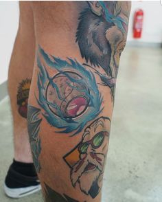 a man's leg with tattoos on it and an image of the same character