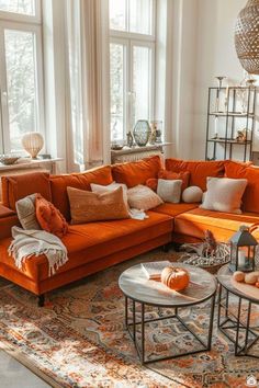 a living room filled with lots of orange furniture