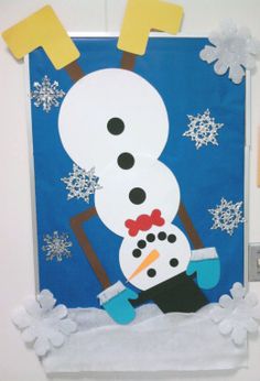 a snowman made out of paper on a blue background with white snowflakes