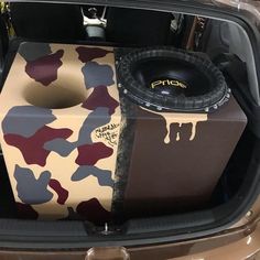 the trunk of a car is decorated with camouflage