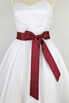 Elegant, beautiful, simple bridal belt made of high-quality bridal satin fabric. The bridal belt is tied in a bow at the back or front. A beautiful and unique accessory that will add charm and individuality to your dress. Colour: wine red You can find matching hair accessories in my shop or simply write to us. This handmade bridal belt matches any wedding dress or evening dress in my collection Etsy shop "charmemode" https://de.etsy.com/de/shop/charmemode size/measurements Bridal belt: 5 cm x 21 Wedding Registry Office, Cranberry Dress, Registry Office Wedding, Bride Wedding Dress, Dress Colour, Wedding Sash Belt, Wedding Belts, Brides Wedding Dress, Bridal Belt