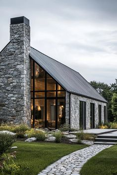 a stone house with a walkway leading to it