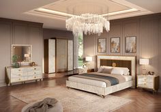 a bedroom with a chandelier, bed, dressers and two mirrors on the wall