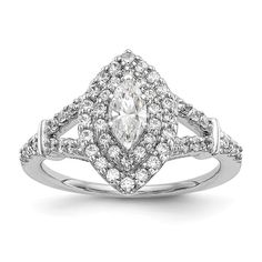 a white gold ring with diamonds on the sides and an oval shaped diamond in the center