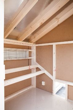 the inside of a storage room that is being built with unfinished walls and shelving