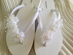 These beautiful flip flops are wrapped in white satin ribbon, and adorned with a  white flowers. Ribbon color is white, if you are needing other colors of ribbon or decoration please contact me and will be happy to accommodate you! All flip flops are handmade to order and the production time 1 to 2 weeks and then please allow additional time for shipping. Amazing for beach, weddings, flower girl or a fancy event, you choose! Please choose your size from the drop box. Beach Wedding Flip Flops, Flip Flops Wedding, Bridesmaid Flip Flops, Shoes Costume, Fancy Flip Flops, Bridesmaid Sandals, Bride Sandals, Flip Flop Craft, Bridesmaid Slippers