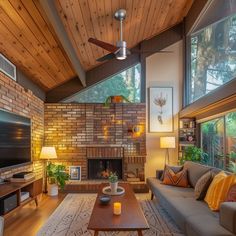 a living room filled with furniture and a flat screen tv on top of a wooden ceiling