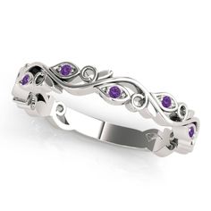 a white gold ring with purple sapphire stones