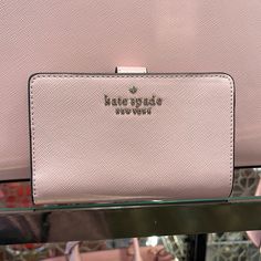 Kate Spade Staci Medium Compact Bifold Wallet Conch Pink Color: Conch Pink New With The Tag Authentic 4.5" H X 5.5" W X 1" D Saffiano Leather Ksny Metal Pinmount Logo Two Way Spade Jaquard Lining Interior: 8 Credit Card Slots, Id Window, 4 Slip Pockets, 2 Bill Folds Exterior: L-Zip Coin Compartment Snap Closure Dust Bag Not Included Imported Style # Kc580 #Chalk Pink Kate Spade Chalk Pink, Kate Spade Staci, Card Holder Case, Pink Cards, Black Leather Wallet, Wallet Organization, Kate Spade Wallet, Black Wallet, Bifold Wallet