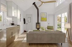 a living room filled with furniture and a fire place in the middle of a kitchen