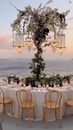 the table is set up for an outdoor dinner