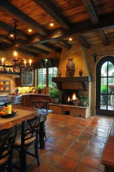 a large kitchen with an oven, table and chairs in front of the stove top