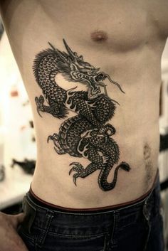 a man with a dragon tattoo on his stomach