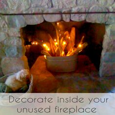 there is a fire place with candles in it and the words decorate inside your unused fireplace