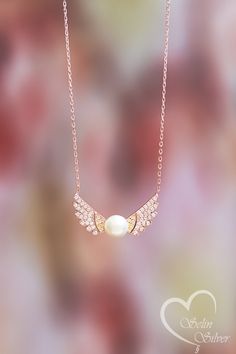 This product, which we designed by combining the nobility of the angel and the elegance of the pearl, will make you or your loved ones feel special. Gift-ready, high-quality, elegant silver pendant necklace to wear in all sorts of occasions. Buy it for yourself or as a special gift for your loved one, family or friends. Special pearl is used in this product. You can always contact us.; I will be happy to help with any requests or questions. FOR GIFT: We send all your orders in our elegant gift-r Elegant Angel Wings Necklaces, Elegant Wing-shaped Jewelry As Gift, Elegant Wing-shaped Jewelry Gift, Elegant Angel Wings Jewelry, Elegant Gold Angel Wings Necklace, Elegant Gold Necklace With Angel Wings, Dainty Pearl Necklace, Necklace With Pearl, Angel Wing Necklace