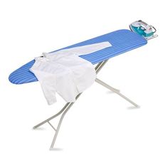 an ironing board with clothes on it