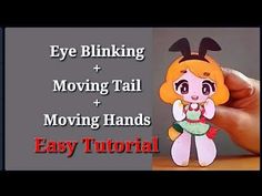 a hand holding a paper doll with the words eye blinking moving tail and moving hands easy