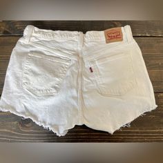 Levi's Women's 501 Raw Cut White Denim Short. New Just Washed. Size 33w Introducing Levi's Women's 501 Raw Cut White Denim Shorts, Available In Size 33w. These Shorts Are Brand New And Have Just Been Washed, Ready For You To Wear. The Raw Cut Hem Adds A Stylish Touch To The Classic 501 Design. #Levis #501 #Denimshorts #Rawcut #Fashion #Womenstyle White Fitted Bottoms With Frayed Hem, Fitted White Bottoms With Frayed Hem, Levi's Cotton Cutoff Bottoms, Fitted Levi's Bottoms With Frayed Hem, Fitted Levi's Cotton Jean Shorts, White Denim Cutoff Bottoms, Levi's White Cutoff Bottoms, Levi's White Cutoff Jean Shorts, Levi's White Denim Bottoms