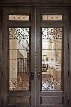 two double doors with glass panels on each side