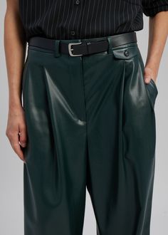 Color: Bottle GreenMidweight faux leather Relaxed straight leg silhouettePleat front detailSlip hip pocketsBack welted pocketsHook and bar closureBelt loopsUnlined100% PolyurethaneDry CleanBy The Frankie Shop. Imported Sleek Leather Straight Pants With Belt Loops, Sleek Straight Leather Pants With Belt Loops, Sleek Faux Leather Pants With Belt Loops, High Waist Leather Pants For Work, Sleek High Waist Leather Pants With Belt Loops, Chic Green Leather Pants For Work, Sleek Leather Pants With Belt Loops For Work, Sleek High-waisted Leather Pants With Belt Loops, Faux Leather Work Pants With Belt Loops