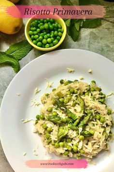 a white plate topped with rice and peas next to a bowl of green pea sprouts