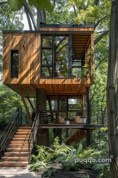 a tree house in the woods with stairs leading up to it's second floor