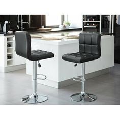 two black leatherette barstools in a kitchen