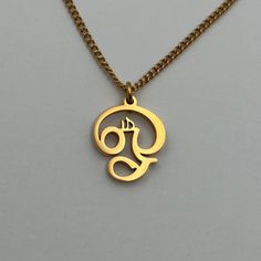 "A piece that embodies the power of the \"Om\" symbol, bringing inner peace and harmony to every moment. This XS Om II is made in Tamil script and Gold plated." Tamil Om Pendant Gold, Personalized Symbolic Jewelry For Meditation, Om Pendant For Men, Tamil Script, The Om Symbol, Om Necklace, Om Pendant, Om Symbol, Gold Ring Designs