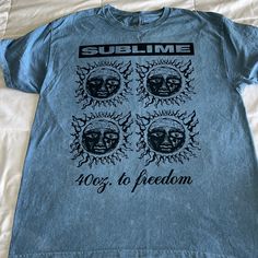 Sublime T-Shirt, Faded Light Blue, New With Tag, L, 100% Cotton Washed Blue Graphic Tee For Streetwear, Summer Acid Wash Top With Front Print, Acid Wash Top With Front Print For Summer, Acid Wash Tops With Front Print For Summer, Washed Blue Graphic Print Top For Streetwear, Blue T-shirt For Summer Streetwear, Summer Blue T-shirt For Streetwear, Blue Streetwear T-shirt For Summer, Blue Summer Streetwear T-shirt