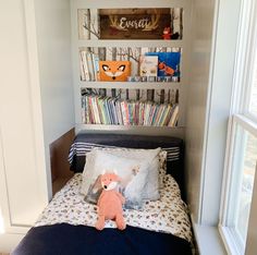 a small bed with a stuffed animal on it