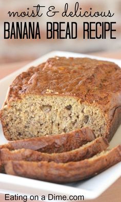 a loaf of banana bread sitting on top of a white plate