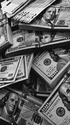 black and white photograph of many hundred dollar bills