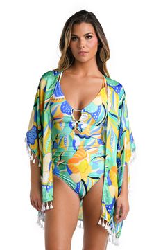 Model is wearing a multicolored Kimono Swimsuit Cover Up Beachy Tropical Print Cover-up For Beach, Vibrant Swimwear For Summer Beach Cover-up, Spring Multicolor Swimwear For Beach Cover-up, Spring Tropical Print Cover-up For Poolside, Beachy Green Cover-up With Tropical Print, Green Floral Print Summer Cover-up, Summer Tropical Print Poolside Cover-up, Blue Swimwear With Bold Print For Beach, Beach Party Tropical Print Cover-up